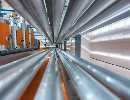 Pipes, tubes, machinery at factory.