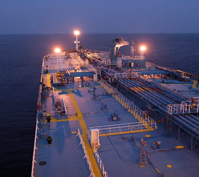 Close view of the supertanker's deck in the night.